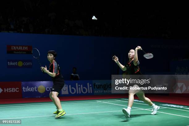 Chen Qingchen and Jia Yifan of China compete against Chow Mei Kuan and Lee Meng Yean of Malaysia during the Women's Doubles Round 2 match on day...