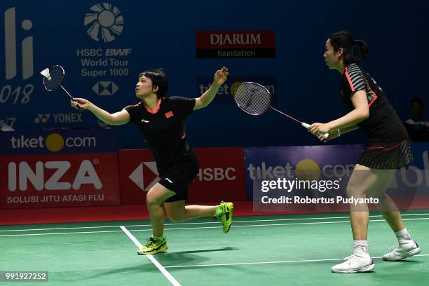 Chen Qingchen and Jia Yifan of China compete against Chow Mei Kuan and Lee Meng Yean of Malaysia during the Women's Doubles Round 2 match on day...