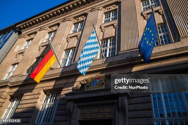 German, a flag from Bavaria and and European Flag wave in front of the entrance of the Permanent representation of Bavaria with the Federal...