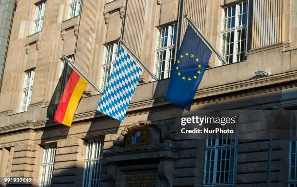 German, a flag from Bavaria and and European Flag wave in front of the entrance of the Permanent representation of Bavaria with the Federal...