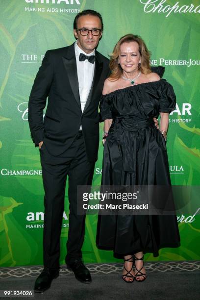 Caroline Scheufele and guest attends the amfAR Paris Dinner 2018 at The Peninsula Hotel on July 4, 2018 in Paris, France.
