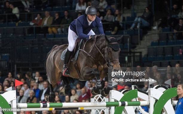 Belgian show jumper Francois Jr Mathy on horse Uno de la Roque in action at the Grand Prix of Stuttgart of the FEI World Cup equestrian competition...