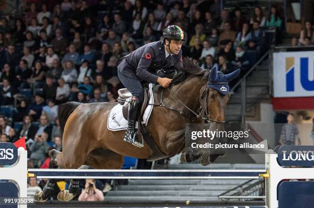 Italian show jumper Emilio Bicocchi on horse Sassicaia Ares in action at the Grand Prix of Stuttgart of the FEI World Cup equestrian competition in...