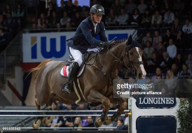Irish show jumper Cameron Hanley on horse Eis Isaura in action at the Grand Prix of Stuttgart of the FEI World Cup equestrian competition in...