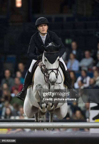 Norwegian show jumper Marit Haarr Skollerud on horse Nicole in action at the Grand Prix of Stuttgart of the FEI World Cup equestrian competition in...