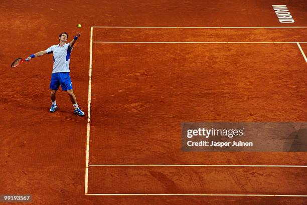 Andy Murray of Great Britain serves the ball to Victor Hanescu of Romania in their third round match during the Mutua Madrilena Madrid Open tennis...