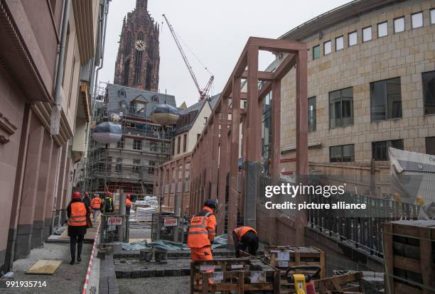 Construction workers are busy at work on a construction site in the old town centre of Frankfurt, Germany, 20 November 2017. After the large scale...