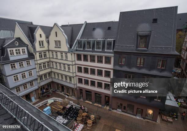 Houses with reconstructed historic fronts frame a historic market square in the old town centre of Frankfurt, Germany, 20 November 2017. After the...