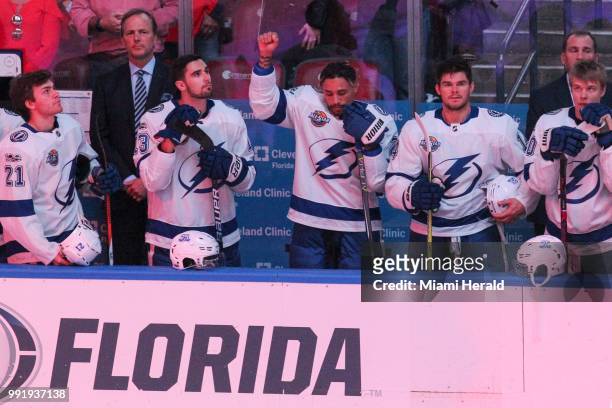The Tampa Bay Lightning's J.T. Brown protests during the national anthem before the start of a game against the Florida Panthers at the BB&T Center...