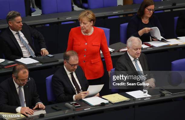 German Chancellor and leader of the German Christian Democratic Union Angela Merkel walks past Interior Minister and leader of the CDU sister party,...