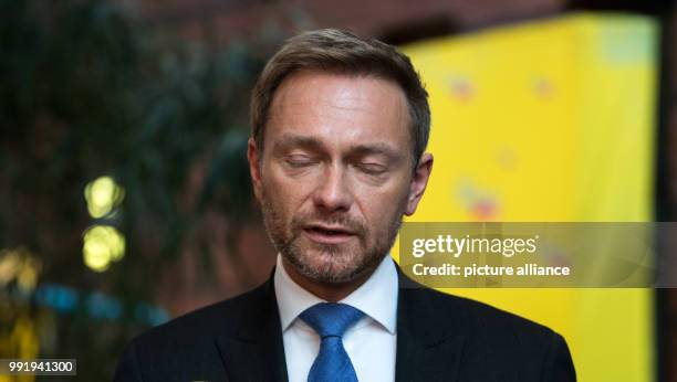 Leader of the liberal Free Democratic Party of Germany Christian Lindner reacts as he speaks to media prior to the FDP Presidium meeting after the...