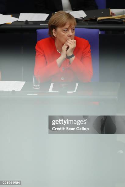 German Chancellor and leader of the German Christian Democratic Union Angela Merkel looks on as Interior Minister and leader of the CDU sister party,...