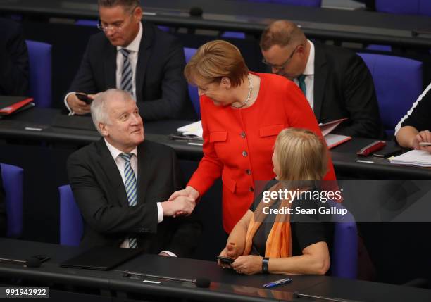 German Chancellor and leader of the German Christian Democratic Union Angela Merkel greets Interior Minister and leader of the CDU sister party, the...