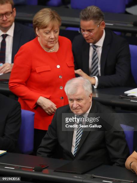 German Chancellor and leader of the German Christian Democratic Union Angela Merkel walks toward Interior Minister and leader of the CDU sister...