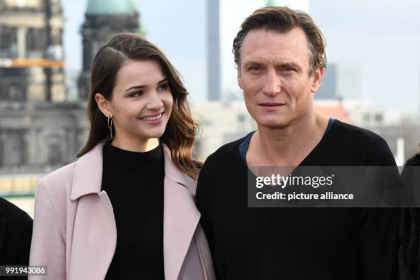 The actress Lisa Vicari and actor Oliver Masucci stand beside each other during a photoshoot for the European premiere of the Netflix series "Dark"...