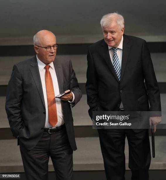 German Interior Minister and leader of the Bavarian Social Union , Horst Seehofer , chats with Volker Kauder, Bundestag faction leader of the German...