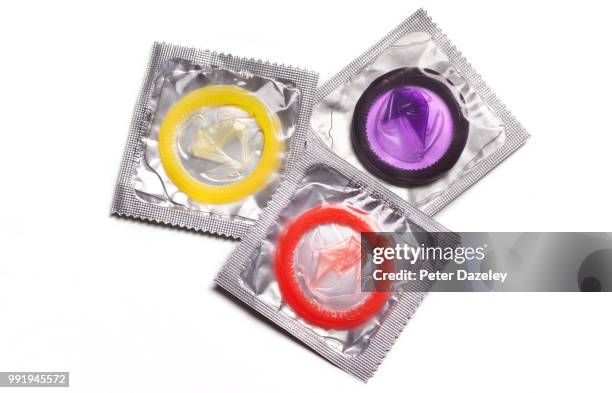 three coloured condoms - condoms - fotografias e filmes do acervo