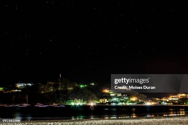 san juan del sur bay at night - san juan del sur stock-fotos und bilder