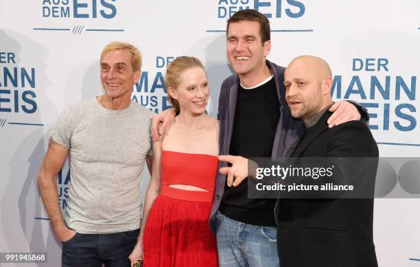 The actors Andre M. Hennicke , Susanne Wuest, the director Felix Randau and actor Juergen Vogel arrive for the premiere of the film "Der Mann aus dem...