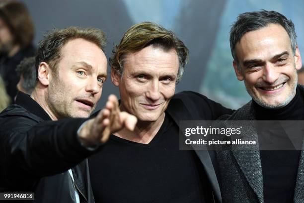 Actors Mark Waschke , Oliver Masucci und Anatol Taubman arrive at the Europe Premiere of Netflix series 'Dark' in Berlin, Germany, 20 November 2017....