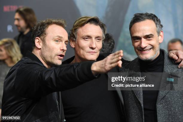 The actors Mark Waschke, Oliver Masucci and Anatol Taubman attend the premiere of the Netflix series 'Dark' in Berlin, Germany, 20 November 2017....