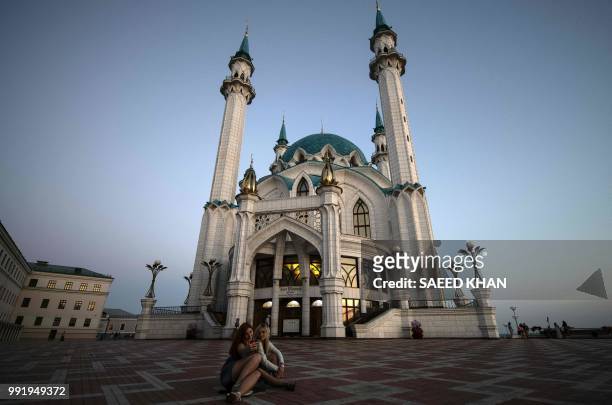 Two girls take a selfie-photo in front of Qolsharif mosque at Kremlin in Kazan on July 4, 2018 during the Russia 2018 World Cup football tournament.