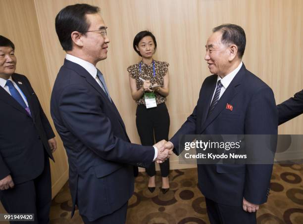 South Korean Unification Minister Cho Myoung Gyon and North Korea's Kim Yong Chol, vice chairman of the Central Committee of the Workers' Party of...