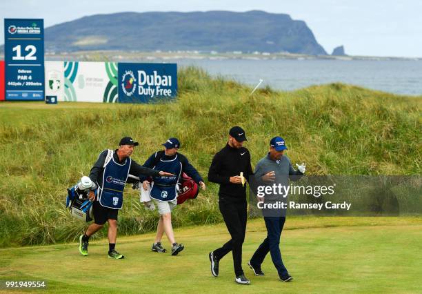 Donegal , Ireland - 5 July 2018; Chris Wood of England in conversation with Padraig Harrington of Ireland on the 12th fairway during Day One of the...