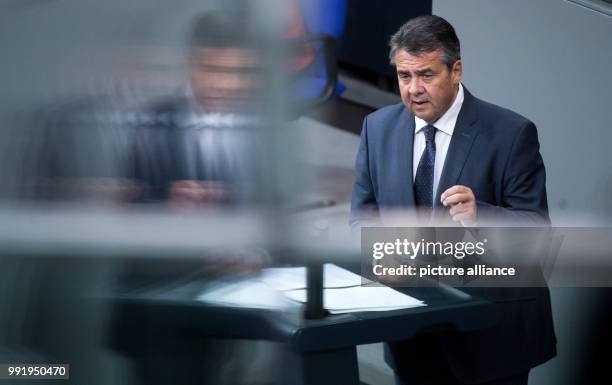 German Foreign Minister Sigmar Gabriel talks during a plenary session of the German Bundestag in Berlin, 21 November 2017. In its second session of...