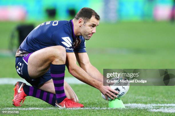 Cameron Smith of the Storm prepares to kick the ball in the warm up during the round 17 NRL match between the Melbourne Storm and the St George...