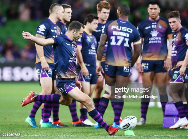 Cameron Smith of the Storm kicks the ball in the warm up during the round 17 NRL match between the Melbourne Storm and the St George Illawarra...