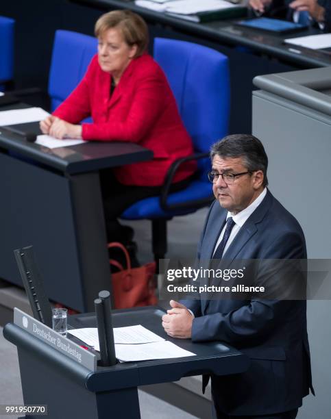 German Foreign Minister Sigmar Gabriel talks during a plenary session of the German Bundestag in Berlin, 21 November 2017. In its second session of...