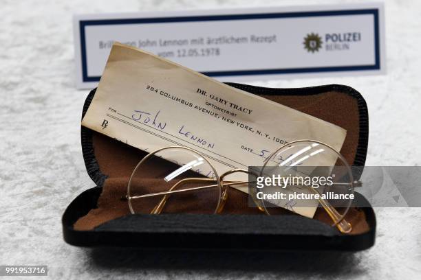 The police department of Berlin shows stolen glasses of Beatles musician John Lennon during a press conference in Berlin, Germany, 21 November 2017....