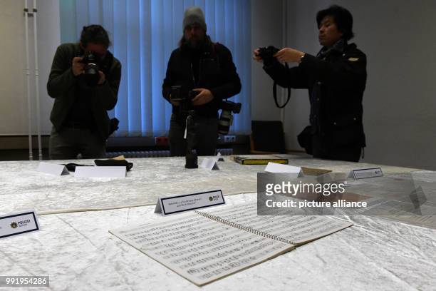 The police department of Berlin shows a notes book of Beatles musician John Lennon during a press conference in Berlin, Germany, 21 November 2017....