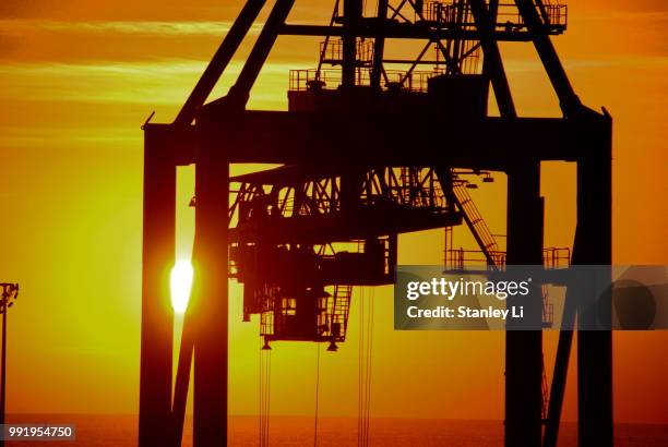gantry crane in the morning - mine workings stock pictures, royalty-free photos & images