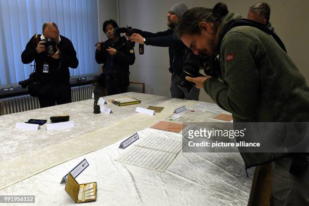 The police department of Berlin shows stolen goods of Beatles musician John Lennon's during a press conference in Berlin, Germany, 21 November 2017....