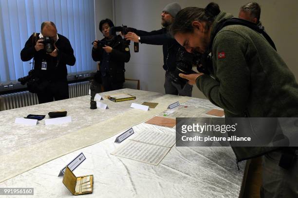 The police department of Berlin shows stolen goods of Beatles musician John Lennon during a press conference in Berlin, Germany, 21 November 2017....