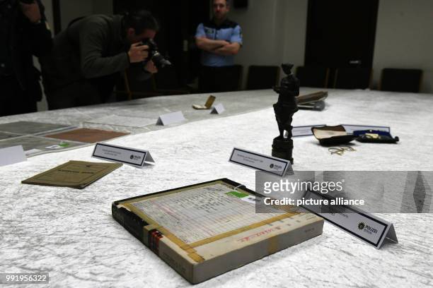 The police department of Berlin shows stolen goods of Beatles musician John Lennon during a press conference in Berlin, Germany, 21 November 2017....