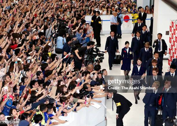 Football fans welcome Japan national team arriving at Narita International Airport after the FIFA World Cup on July 5, 2018 in Narita, Chiba, Japan.