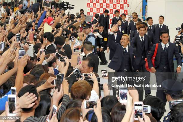 Football fans welcome Japan national team arriving at Narita International Airport after the FIFA World Cup on July 5, 2018 in Narita, Chiba, Japan.
