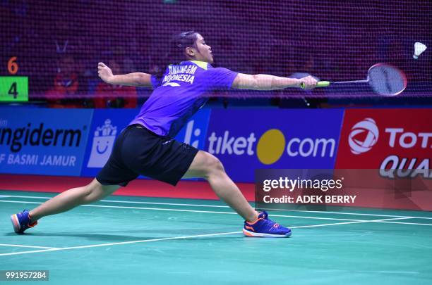 Gregoria Mariska Tunjung of Indonesia plays a return against Ratchanok Intanon of Thailand during their women's singles badminton match at the...