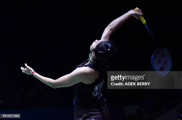 Ratchanok Intanon of Thailand plays a return against Gregoria Mariska Tunjung of Indonesia during their women's singles badminton match at the...