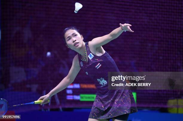 Ratchanok Intanon of Thailand plays a return against Gregoria Mariska Tunjung of Indonesia during their women's singles badminton match at the...