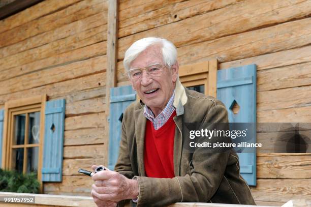 The actor Siegfried Rauch smiles during the press tour 'Zehn Jahre und 100 Folgen - Der Bergdoktor' at the Leonardo Royal Hotel in Munich, Germany,...