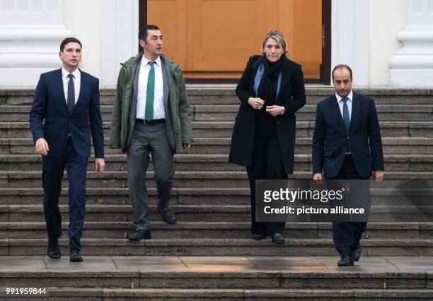The German Green party leaders, Cem Oezdemir and Simone Peter leave the Bellevue Palace after a meeting with German President Frank-Walter Steinmeier...