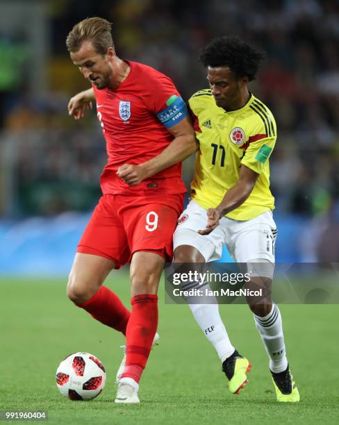 Harry Kane of England vies with Juan Cuadrado of Colombia during the 2018 FIFA World Cup Russia Round of 16 match between Colombia and England at...