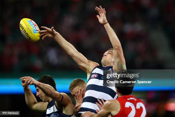 Joel Selwood of the Cats taps the ball during the round 16 AFL match between the Sydney Swans and the Geelong Cats at Sydney Cricket Ground on July...