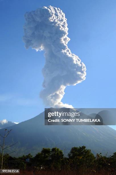 Mount Agung volcano sends up another plume of smoke, seen from the Kubu subdistrict in Karangasem Regency on Indonesia's resort island of Bali on...