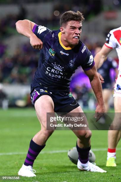 Brodie Croft of the Storm scores a try during the round 17 NRL match between the Melbourne Storm and the St George Illawarra Dragons at AAMI Park on...