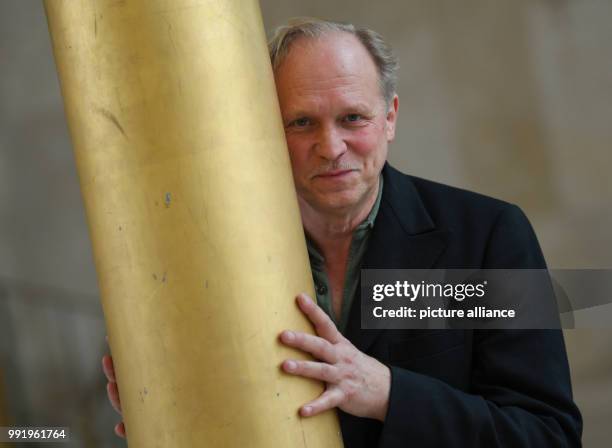 The actor, musician and writer Ulrich Tukur poses for the camera in the course of an interview in the gold hall of the Hessische Rundfunk in...
